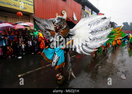 Bogor, Indonesia. 02nd Mar, 2018. Indonesian artists perform during the people's party and Chinese Cap Go Meh festival on a street in Bogor, Indonesia, 02 March 2018. Chinese-Indonesians across the country celebrate Cap Go Meh on the 15th day in the first month of the Chinese lunar New Year. Credit: Adriana Adinandra/Pacific Press/Alamy Live News Stock Photo