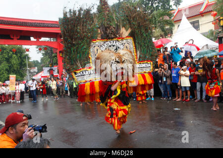 Bogor, Indonesia. 02nd Mar, 2018. Indonesian artists 'Reog Ponorogo' perform during the people's party and Chinese Cap Go Meh festival on a street in Bogor, Indonesia, 02 March 2018. Chinese-Indonesians across the country celebrate Cap Go Meh on the 15th day in the first month of the Chinese lunar New Year. Credit: Adriana Adinandra/Pacific Press/Alamy Live News Stock Photo