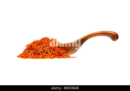 Saffron stamens in the wooden spoon, isolated on white background. Stock Photo