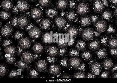 Black beads on macro. High resolution photo. Stock Photo