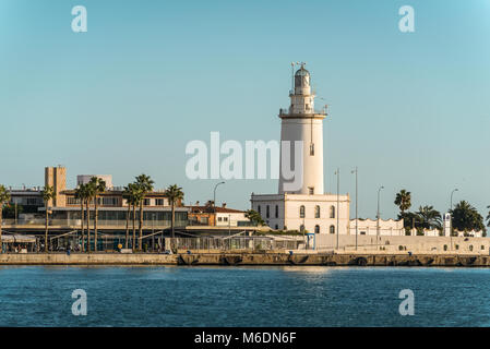 Malaga, Spain - December 7, 2016: Port view and tower lighthouse (La Farola de Malaga) in Malaga, Andalusia, Spain. Stock Photo