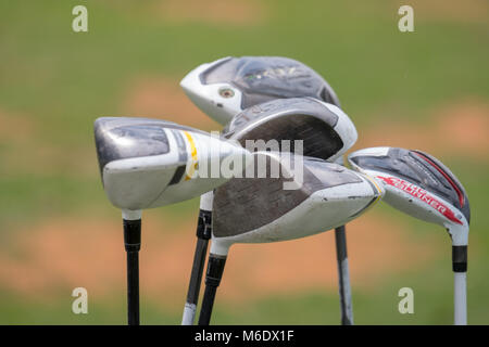 Details of Golf Clubs / Golf iron isolated against golf course Stock Photo