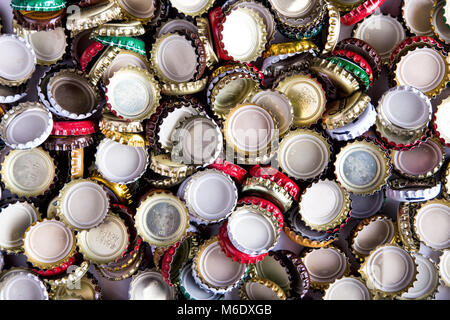 a lot of caps of beer, randomly scattered, background, top view Stock Photo