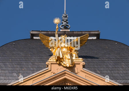 Gera, Germany - March 1,2018: View of the Genius on Sphinx ('Goddess of Truth' ) on the roof of Theater Gera.  The golden figure was created by the sc Stock Photo