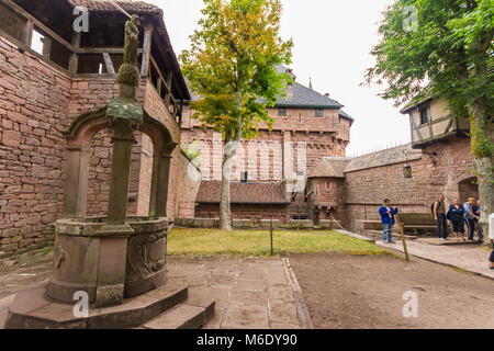 Well and inner courtyard of the Château du Haut-Konigsbourg, a medieval castle located Orschwiller, Bas-Rhin, Alsace, France, in the Vosges mountains  Stock Photo