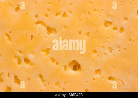 Cheese surface with openings close up texture Stock Photo