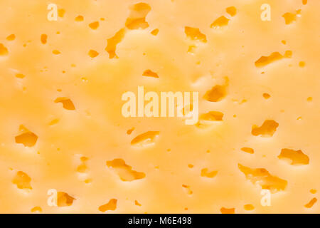 Cheese surface with openings close up texture Stock Photo