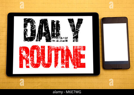 Hand writing text caption inspiration showing Daily Routine. Business concept for Habitual Lifestyle Written on tablet, wooden background with sticky  Stock Photo