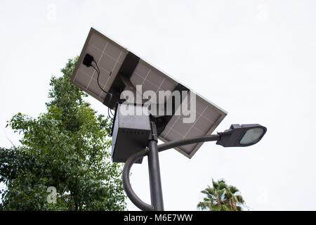 a solar panel and a street light Stock Photo