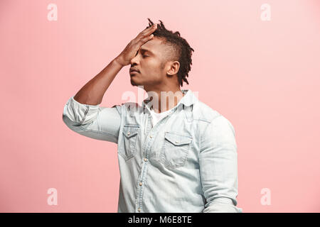 African American Man having headache. Isolated over pink background. Stock Photo