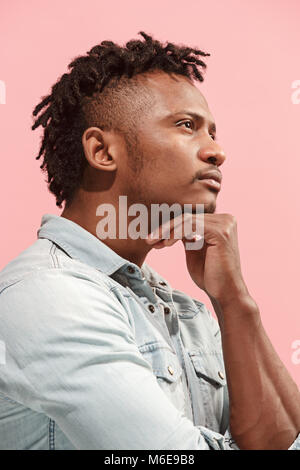 Young serious thoughtful Afro-American businessman. Doubt concept. Profile view Stock Photo