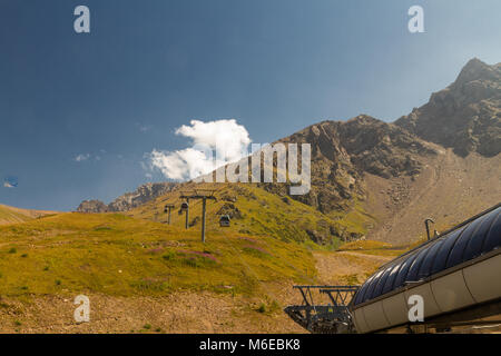 Cable car with mountains in Summer. Shymbulak Ski Resort Hotel in Almaty, Kazakhstan, Asia. Stock Photo