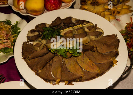 Horsemeat, and Kazy sausage  laid out in restaurant for banquet. Almaty, Kazakhstan, Central Asia Stock Photo