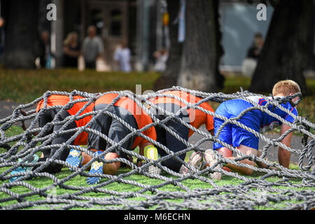 Crawling obstacles at Action run 2017 obstacle race run in the city of Norrköping, Sweden in September 2017 Stock Photo