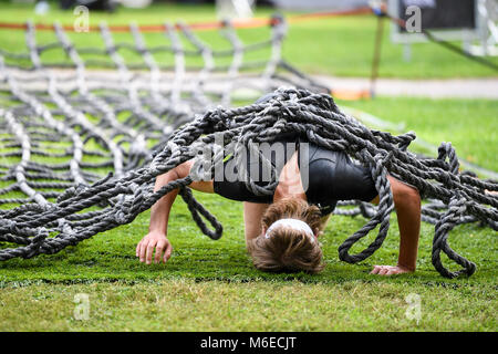 Crawling obstacles at Action run 2017 obstacle race run in the city of Norrköping, Sweden in September 2017 Stock Photo