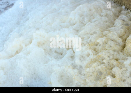 Water pollution caused by oil and chemicals from filtration plant. Useful for background or texture. This environmental degradation happens when chemi Stock Photo