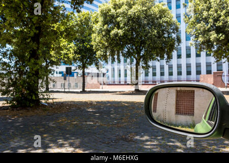 window reflected in car wing mirror Stock Photo