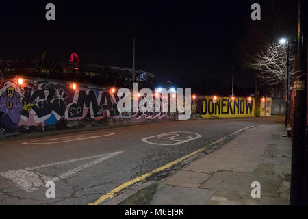 Grafitti and street scene at night in Hackney Wick, east London. Stock Photo