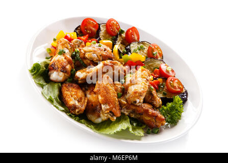 Grilled chicken wings and vegetables Stock Photo