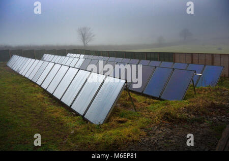 Devon, UK. Solar panels in the mist. Stock Photo