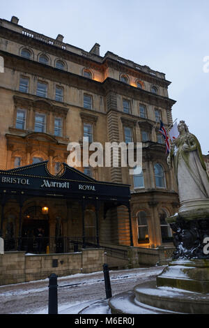 View of the statue of Queen Victoria in front of the Bristol Marriott Royal, College Green, Bristol, in snow from Storm Emma Stock Photo