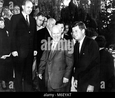 U S President John F Kennedy (right) and Secretary of State Dean Rusk (left) flank Soviet Premier Khrushchev (center) as they walk to the entrance of the American Ambassador's residence in Vienna, where talks were held, Vienna, Austria, 06/03/1961.