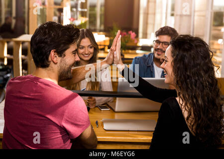 Happy students getting ready for final exams Stock Photo