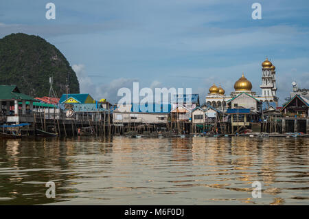 The village of Koh Panyee built above the waters of the Phang Nga bay in Thailand is a small muslim settlement that has become a major tourist attract Stock Photo