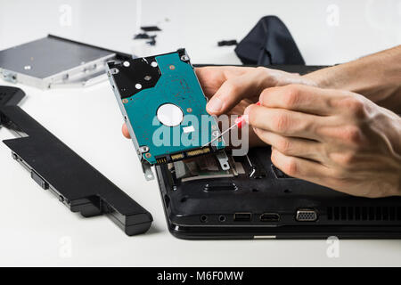 Cleaning old laptop PC Stock Photo