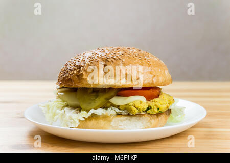 Vegetarian burger on a white plate Stock Photo