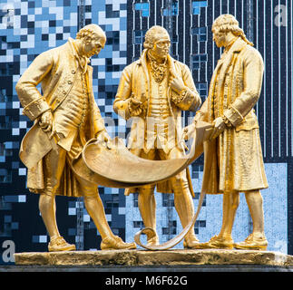 The bronze gilded statue of Boulton, Watt and Murdoch in Centernary Square, Birmingham, West Midlands, England, Europe Stock Photo