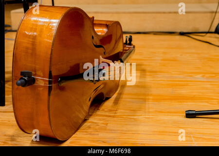 one cello on the floor before concert begins Stock Photo