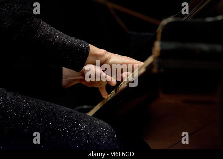 woman plays piano in a concert Stock Photo