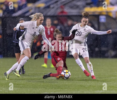 USA FW Savannah McCaskill is fouled by German MF Lena Goeßling but get it through to her teammate Stock Photo