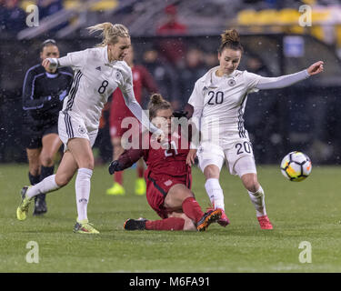 USA FW Savannah McCaskill is fouled by German MF Lena Goeßling but get it through to her teammate Stock Photo