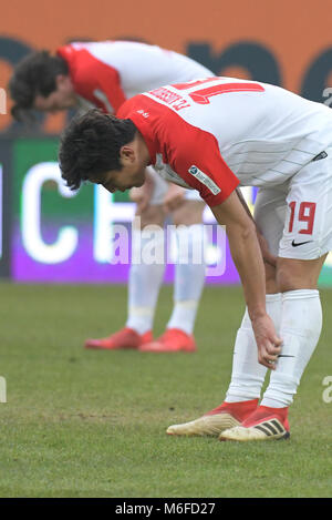 Augsburg, Germany. 3rd March 2018. German Bundesliga match FC Augsburg vs 1899 Hoffenheim at the WWK-Arena. Augsburg's Ja-Cheol Koo (front) and Michael Gregoritsch are disappointed over their 0:2 loss. Photo: Stefan Puchner/dpa - (EMBARGO CONDITIONS - ATTENTION: Due to the accreditation guidelines, the DFL only permits the publication and utilisation of up to 15 pictures per match on the internet and in online media during the match.) Credit: dpa picture alliance/Alamy Live News Stock Photo