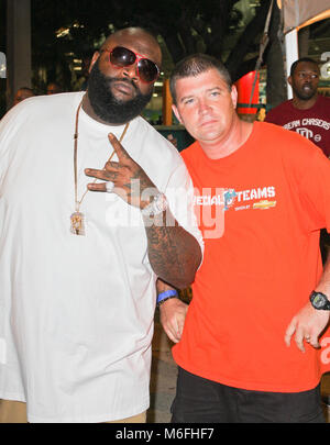 MIAMI GARDENS, FL - SEPTEMBER 12: Rick Ross  arrives at the orange carpet only to witness the Miami Dolphins get crushed on national TV as they loose yet another season opener to the New England Patriots 38 - 24 at Sun Life Stadium. Even one of the teams owners Jennifer Lopez did not even show up for the Monday night football game perhaps she knew something we didnÕt and did not want to waste her time.  On September 12, 2011 in Miami, Florida  People:  Rick Ross Stock Photo