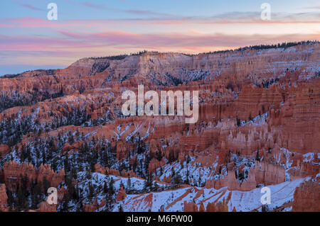 Sunset over the Bryce Canyon, at Sunset Point, in winter, Bryce Canyon National Park, Utah, United States. Stock Photo