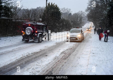 A 4x4 black  Land Rover makes its way along the A36 towards Salisbury as other traffic struggles in the slippery treacherous conditions. Stock Photo