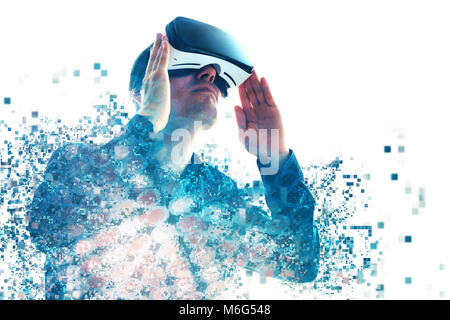 A person in virtual glasses flies to pixels. The man with glasses of virtual reality. Future technology concept. Modern imaging technology. Fragmented by pixels. Stock Photo