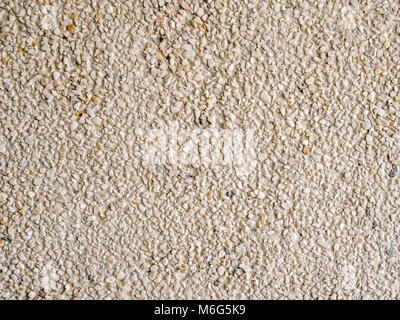Light colour small pebbles or stone wall. Stock Photo