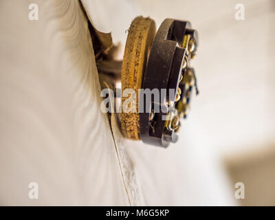 Closeup view broken electrical outlet socket on wall. Stock Photo