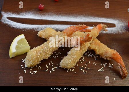 shrimp fried in breadcrumbs. deep fried shrimp meat ball on wooden table. Stock Photo