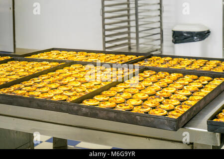 Production of traditional Portuguese eggs pastry called pastel de nata, Lisbon, Portugal Stock Photo