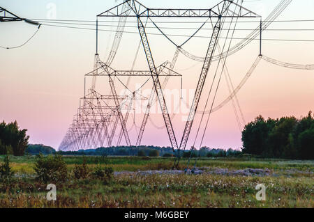 high voltage post. High-voltage tower sky background. Stock Photo
