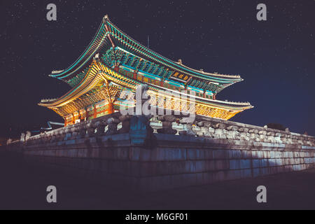 Seoul, Korea - August 14, 2015: Gyeongbokgung palace at night with writing in chinese meaning - 'diligence helps governance' - Seoul, Republic of Kore Stock Photo