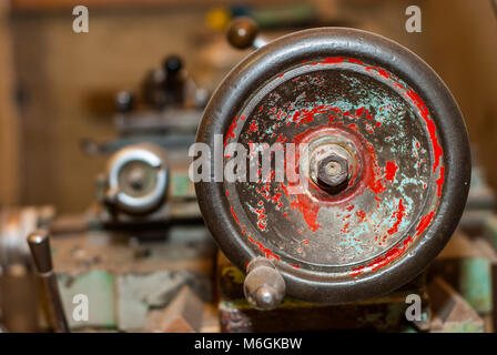 Old metal lathe machine for metalworking in workshop closeup view Stock Photo