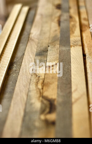 Wooden bars after cutting unedged oak boards Stock Photo