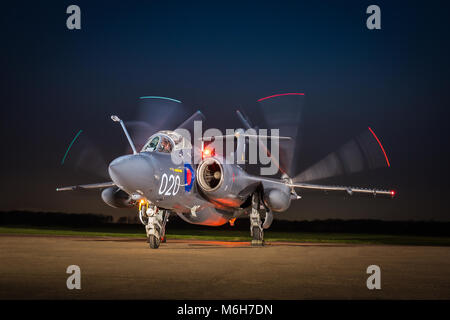 Royal Navy Blackburn Buccaneer aircraft carrier borne attack/strike aircraft at night showing its folding wings for storage. Stock Photo