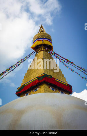 Scenic view of the dome of the Boudhanath Stupa, with prayer flags, Kathmandu, Nepal Stock Photo